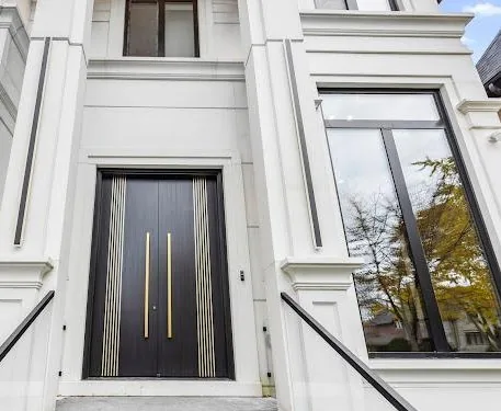 Kaizen Construction Group — premium custom front entry with black and gold door